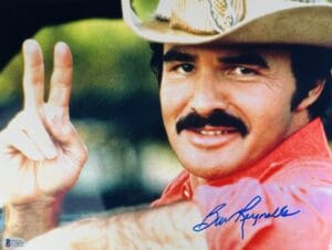 BURT REYNOLDS SIGNED 11X14 METALLIC PHOTO SMOKEY AND THE BANDIT AUTOGRAPH BAS 75