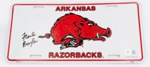 FRANK BROYLES SIGNED ARKANSAS RAZORBACKS LICENSE PLATE HOGS AUTOGRAPH BAS J57