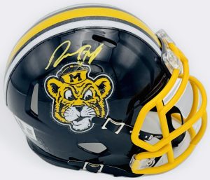 Donovan Olugbode Signed Missouri Tigers Mini Helmet – Mizzou – Autograph – BAS Certified Own a piece of Missouri Tigers football history with this Donovan Olugbode Signed Missouri Tigers Mini Helmet – Mizzou – BAS Certified — a collectible featuring one of the SEC's most productive young wide receivers. 🐯 A Missouri Tigers Standout This Missouri Tigers mini helmet has been personally hand-signed by Donovan Olugbode, wide receiver for the Missouri Tigers. Olugbode has emerged as quarterback Austin Simmons's top target, leading the Tigers and all SEC receivers in receptions while ranking ninth nationally, quickly establishing himself as one of the conference's most dynamic young playmakers. 🪖 Missouri Tigers Mini Helmet This collectible features an official Missouri Tigers mini helmet, offering a compact yet eye-catching display piece. Mini helmets are a popular format among collectors, prized for their affordability, display versatility, and strong connection to a player's collegiate career. ✅ BAS Authenticated This mini helmet has been personally hand-signed by Donovan Olugbode and authenticated by Beckett Authentication Services (BAS), one of the most trusted names in the autograph authentication industry. BAS certification provides collectors with added confidence and peace of mind regarding the autograph's authenticity. 📦 Product Features & Details ✅ Authentic hand-signed autograph from Donovan Olugbode ✅ Missouri Tigers mini helmet ✅ Compact, premium display collectible ✅ BAS Certified ✅ Ideal collectible for Mizzou or SEC football fans ✅ Great display piece for any college football memorabilia collection 🔥 Why This Donovan Olugbode Signed Mini Helmet Is a Must-Have Features one of the SEC's top receiving leaders Mini helmet format offers affordable, premium display appeal BAS authentication ensures peace of mind Great addition to any SEC or college football memorabilia collection Ideal for display in a home, office, or fan cave 📈 Investment-Grade College Football Memorabilia Signed mini helmets from standout college athletes continue to attract strong collector interest, especially from breakout talents like Donovan Olugbode. With verified BAS authentication and strong display appeal, this piece offers excellent long-term collectible potential. Secure this Donovan Olugbode Signed Missouri Tigers Mini Helmet – Mizzou – BAS Certified today and add a standout Mizzou collectible to your collection.
