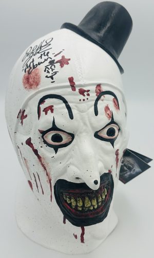 David Howard Thornton autograph, Art the Clown mask, Terrifier signed mask, Trick or Treat Studios mask, official horror mask, signed horror prop, Terrifier memorabilia, BAS certified autograph, Art the Clown collectible, slasher mask collectible, modern horror collectible, horror display piece, Terrifier fan item, signed collectible mask, horror memorabilia